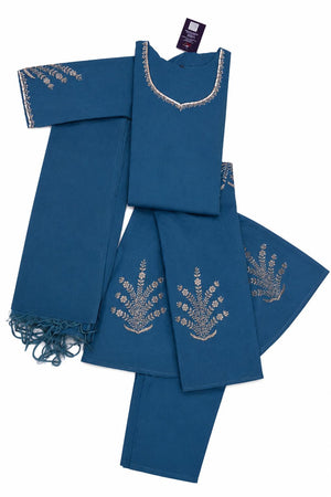 A folded blue traditional outfit set with matching pants and a fringed dupatta, featuring silver embroidered patterns on the neckline and fabric.