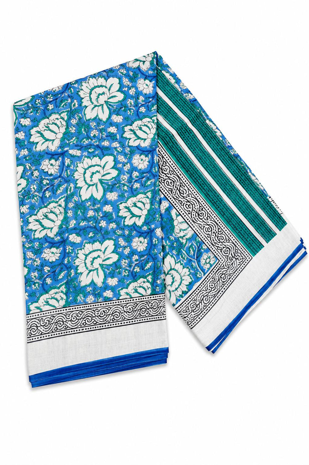 A woman modeling a royal blue saree with white floral prints, a white border with blue and green stripes, and a matching blue blouse.